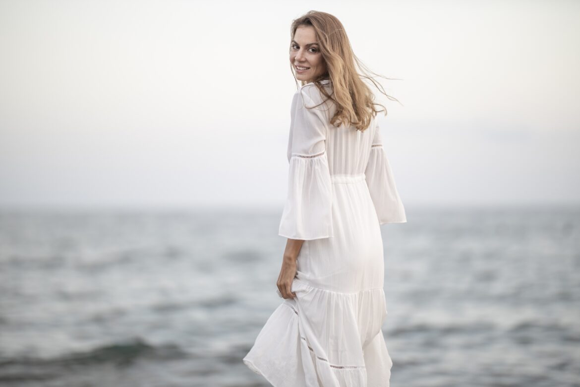 beautiful woman in white dress by the sea Image by Engin Akyurt from Pixabay